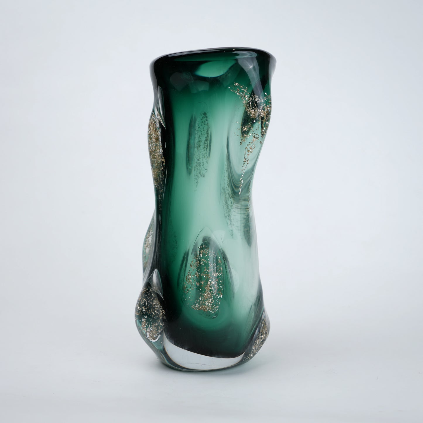 Green glass vase with glittery accents on a white background