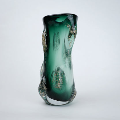 Green glass vase with glittery accents on a white background