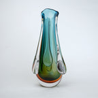 Green and teal glass vase with amber base and flowing drip design in clear glass