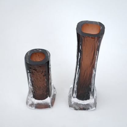 Decorative mocha glass vase featuring layered clear glass outer body and textured base with warm tone finish