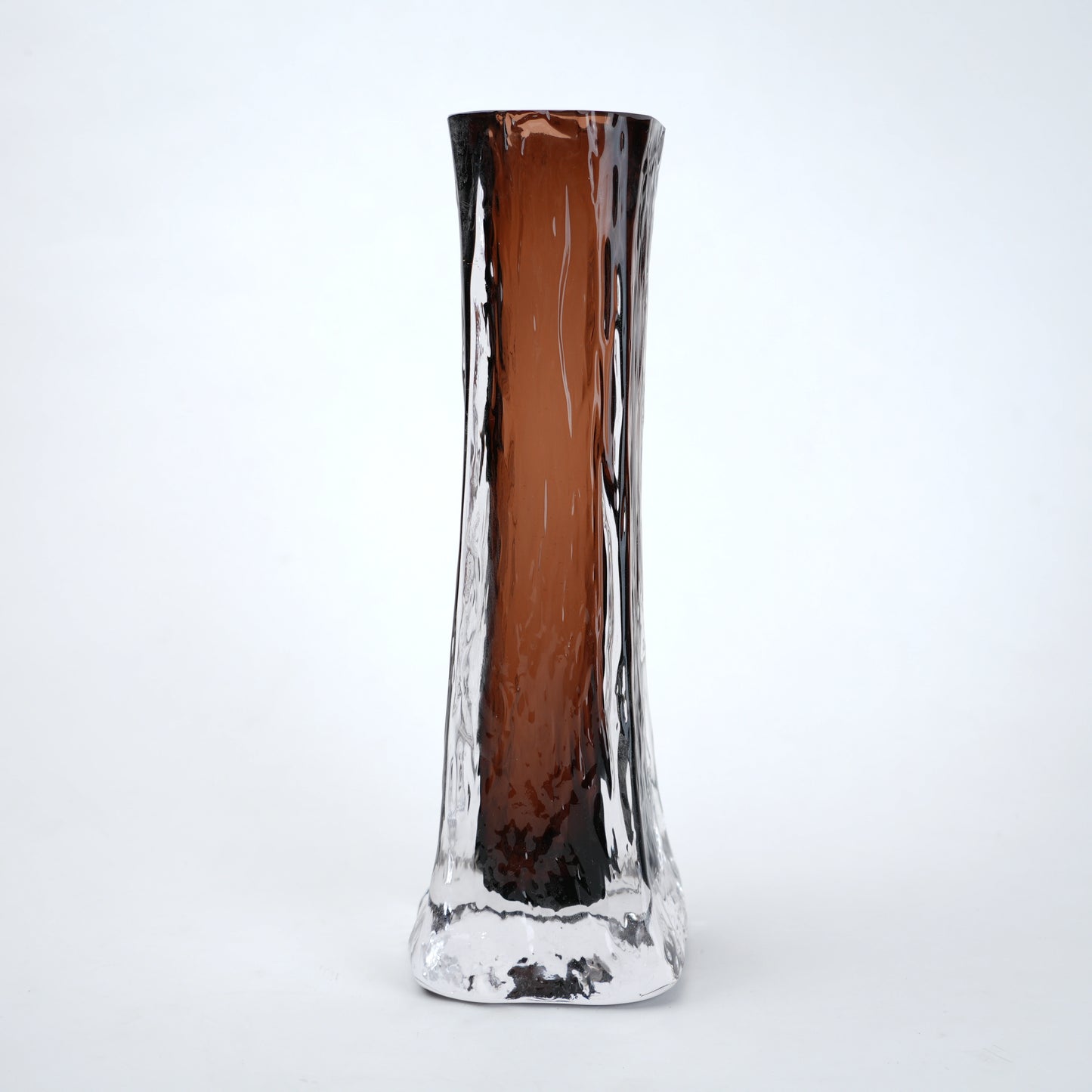 Glass vase with brown and clear design on a white background