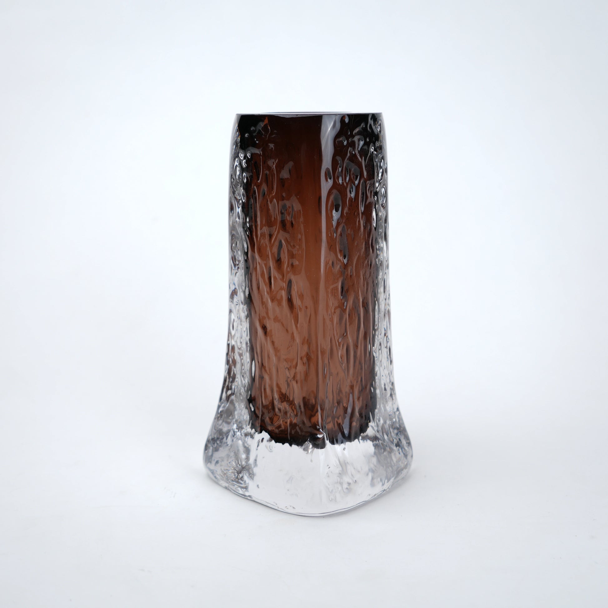 Decorative mocha glass vase featuring layered clear glass outer body and textured base with warm tone finish