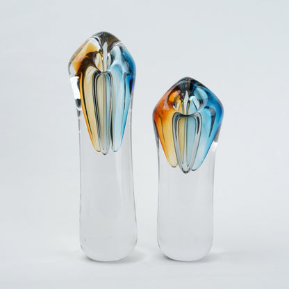 Two glass vases with multicolored tops
