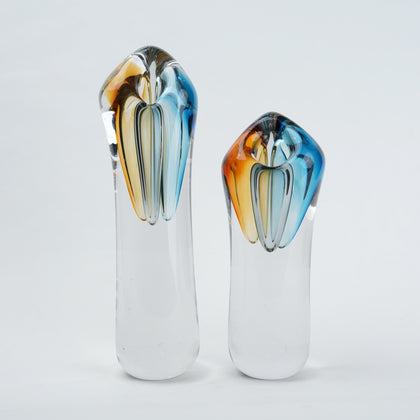 Two glass vases with multicolored tops