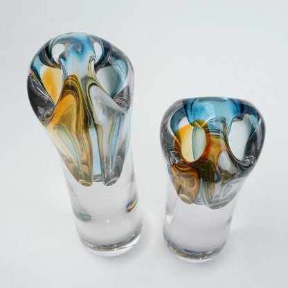 Two glass vases with multicolored swirl patterns