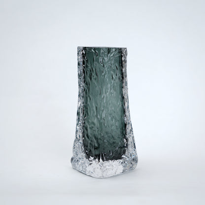 Tall, textured glass vase on a white background