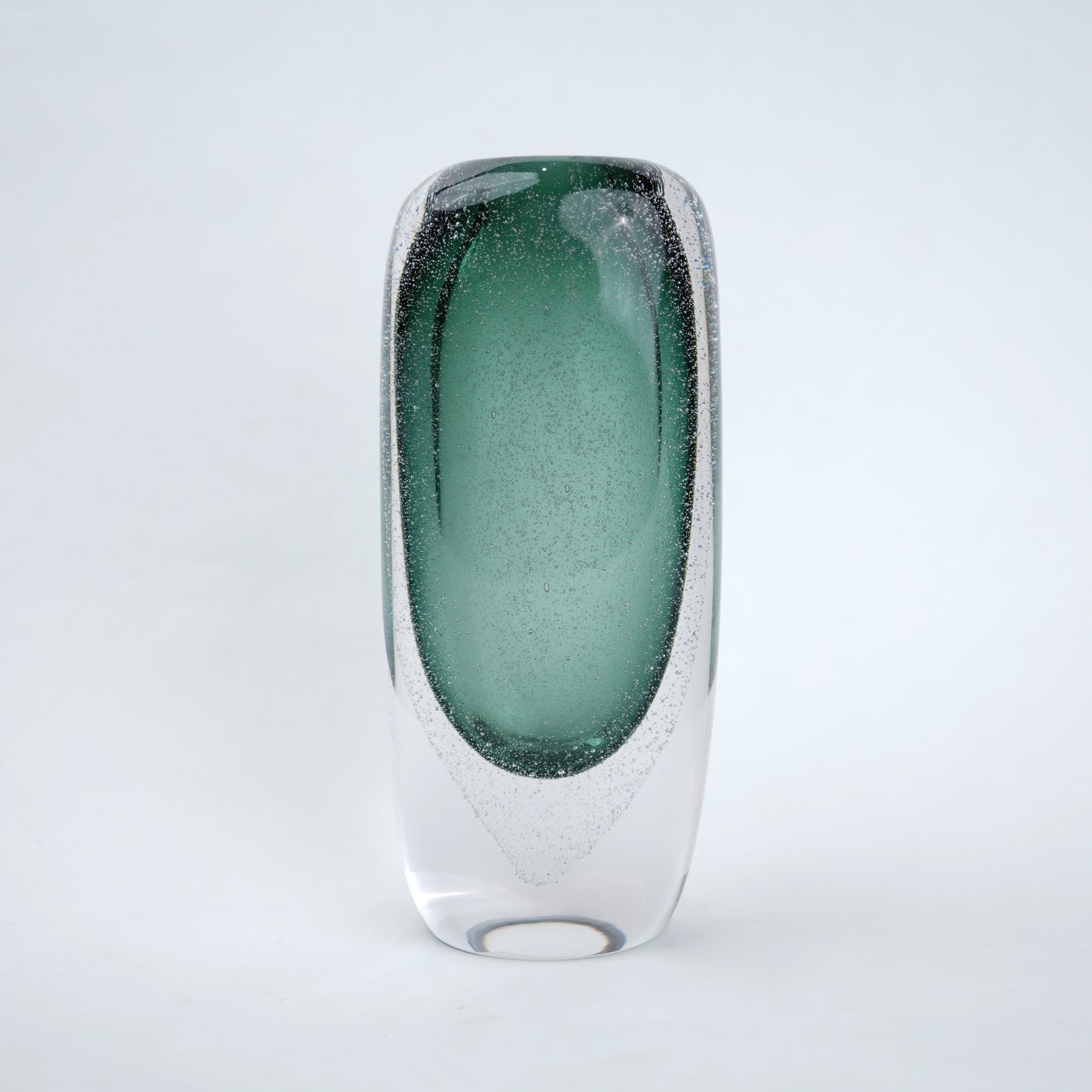 Decorative art glass vase with green gradient center encased inside clear glass body.