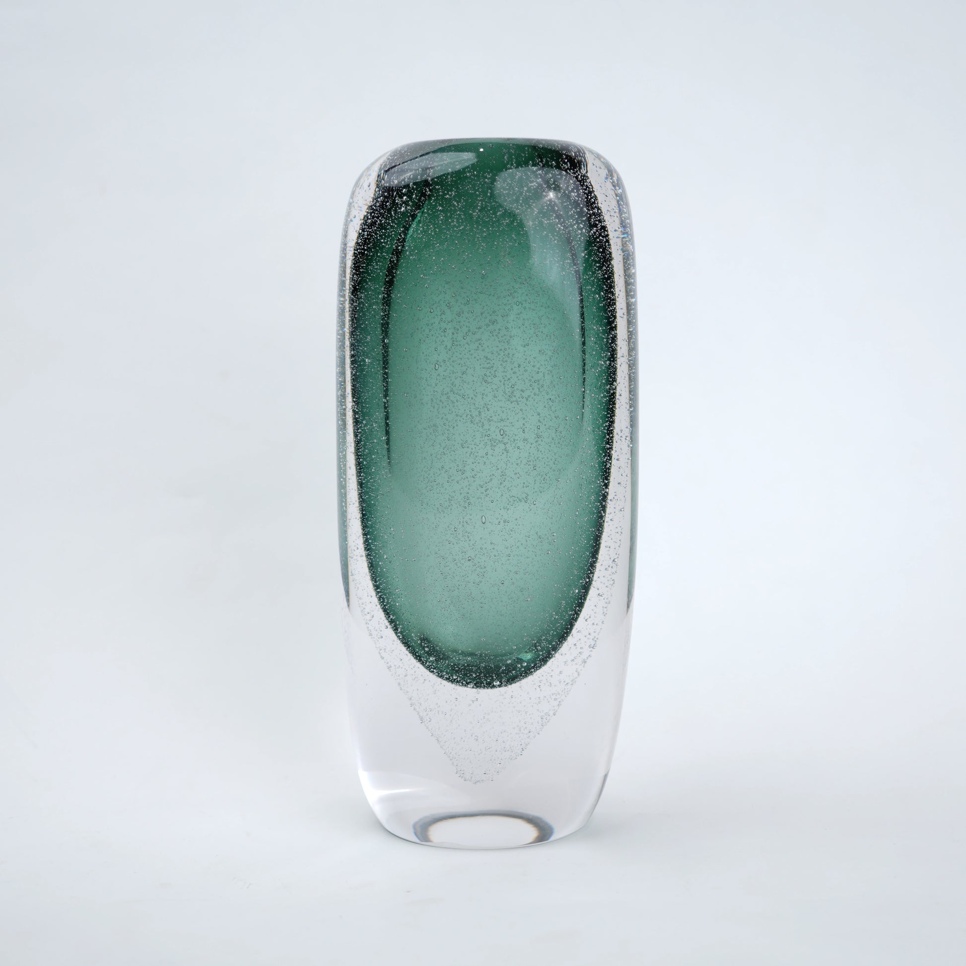 Decorative art glass vase with green gradient center encased inside clear glass body.