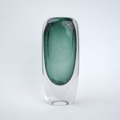 Decorative art glass vase with green gradient center encased inside clear glass body.