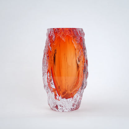 Glass vase with red and orange gradient on a white background
