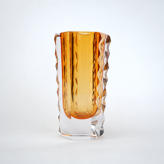 Decorative glass vase with luminous core and geometric clear glass structure
