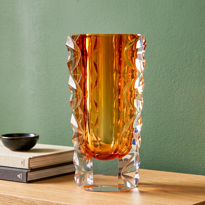 Decorative glass vase with luminous core and geometric clear glass structure