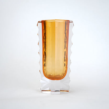 Decorative glass vase with luminous core and geometric clear glass structure