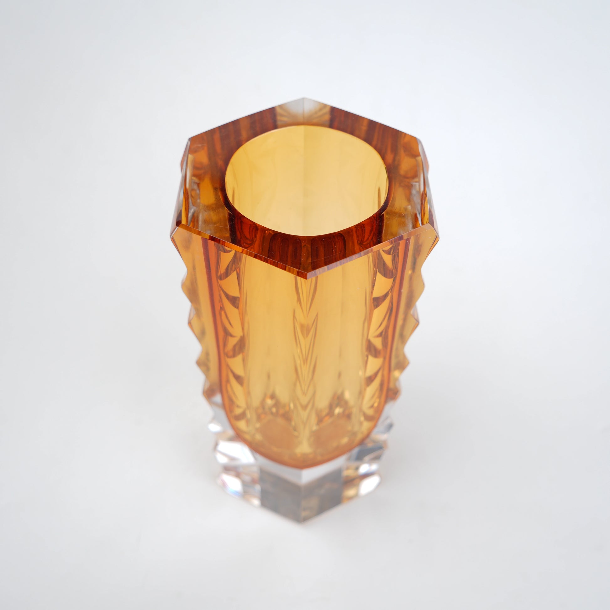 Decorative glass vase with luminous core and geometric clear glass structure