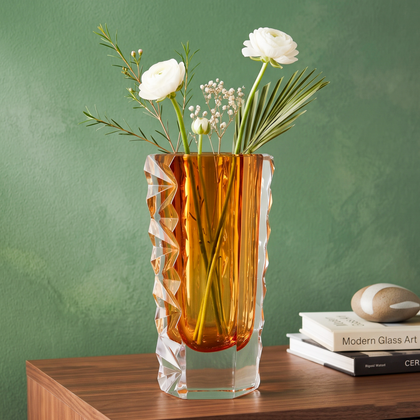 Decorative glass vase with luminous core and geometric clear glass structure