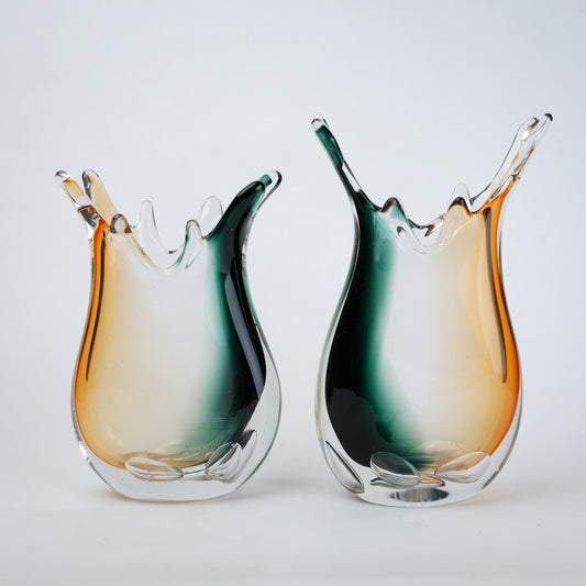 Green clear dual tone glass vase with an organic shape and uneven rim, featuring a thick base and smooth blended finish for modern home decor.