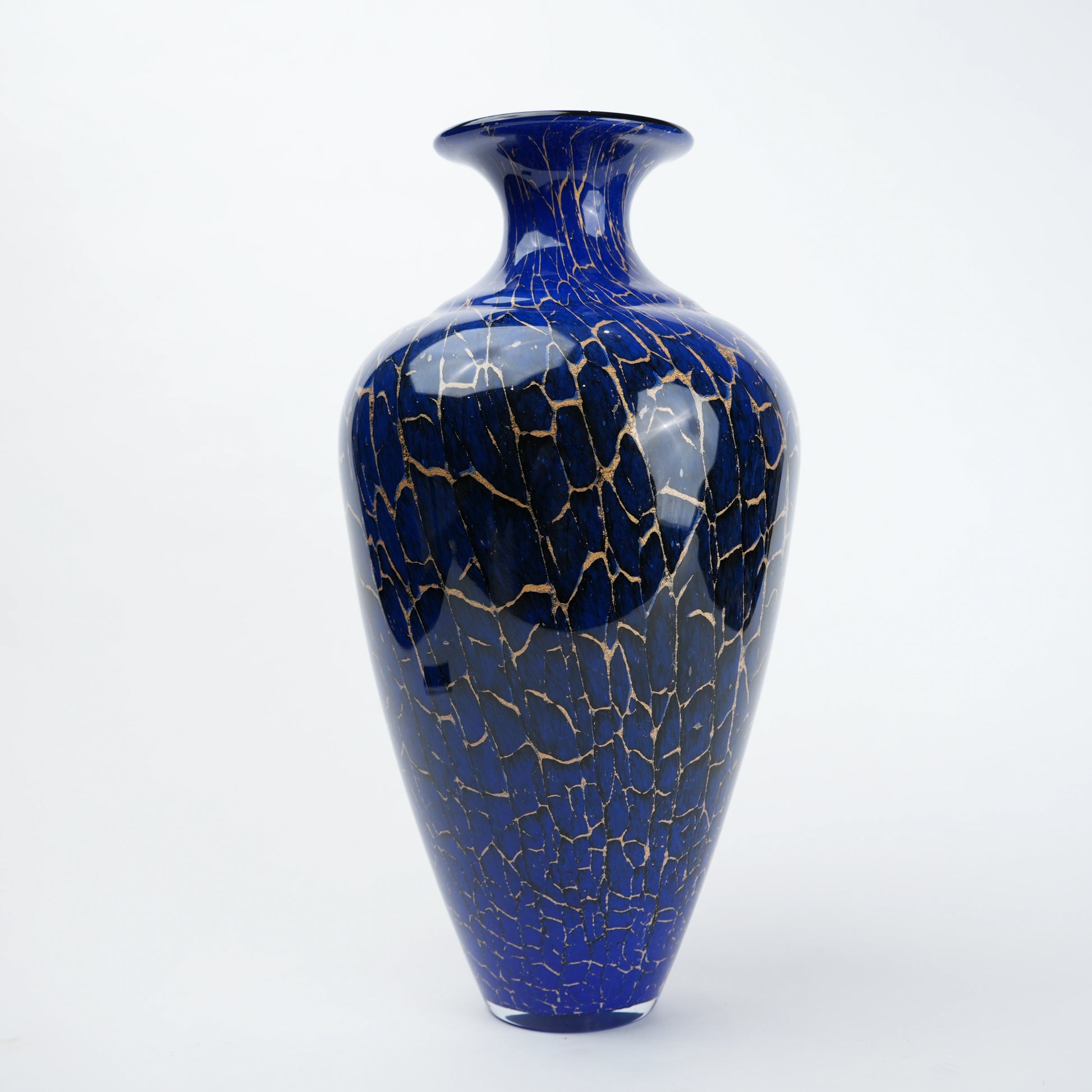 Royal blue glass vase with glossy finish featuring gold crackle detailing and rounded body with narrow neck opening