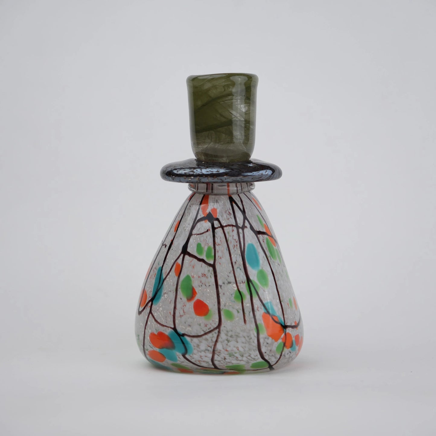 multicolor abstract glass candle holder with orange green accents and black drip design
