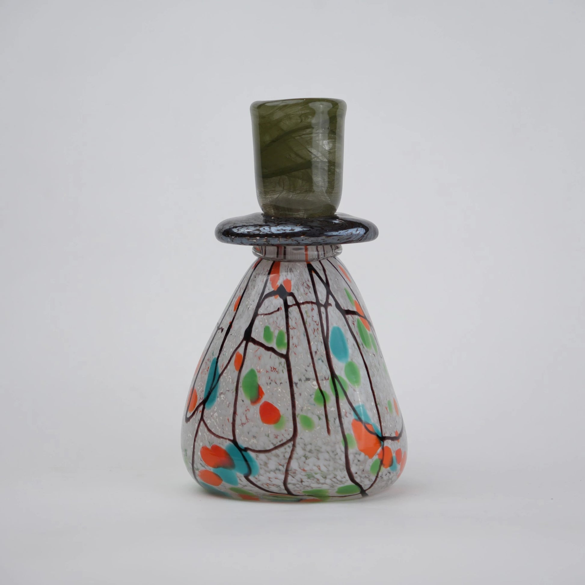 multicolor abstract glass candle holder with orange green accents and black drip design
