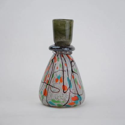multicolor abstract glass candle holder with orange green accents and black drip design