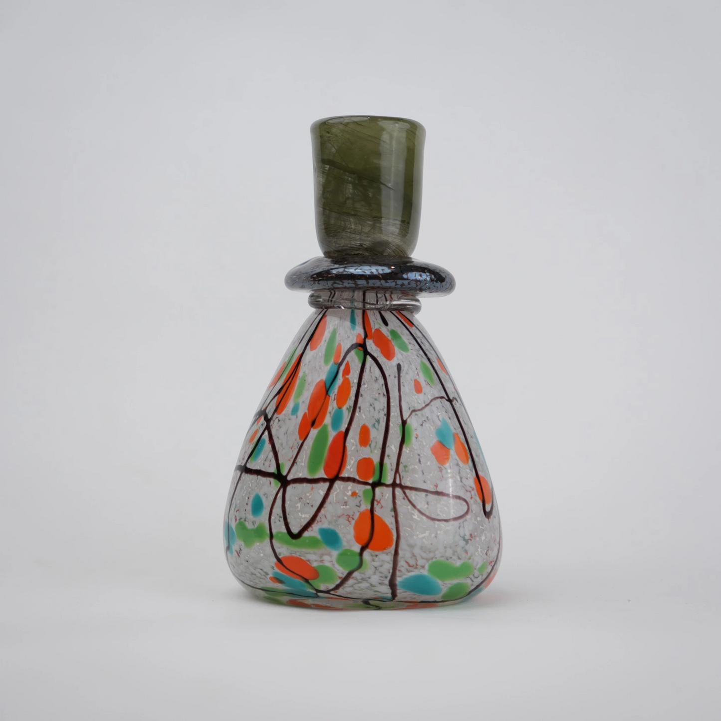 multicolor abstract glass candle holder with orange green accents and black drip design