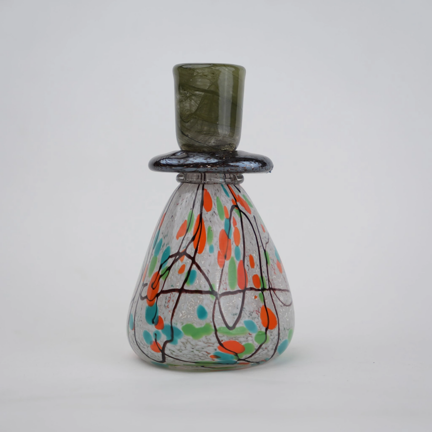 multicolor abstract glass candle holder with orange green accents and black drip design