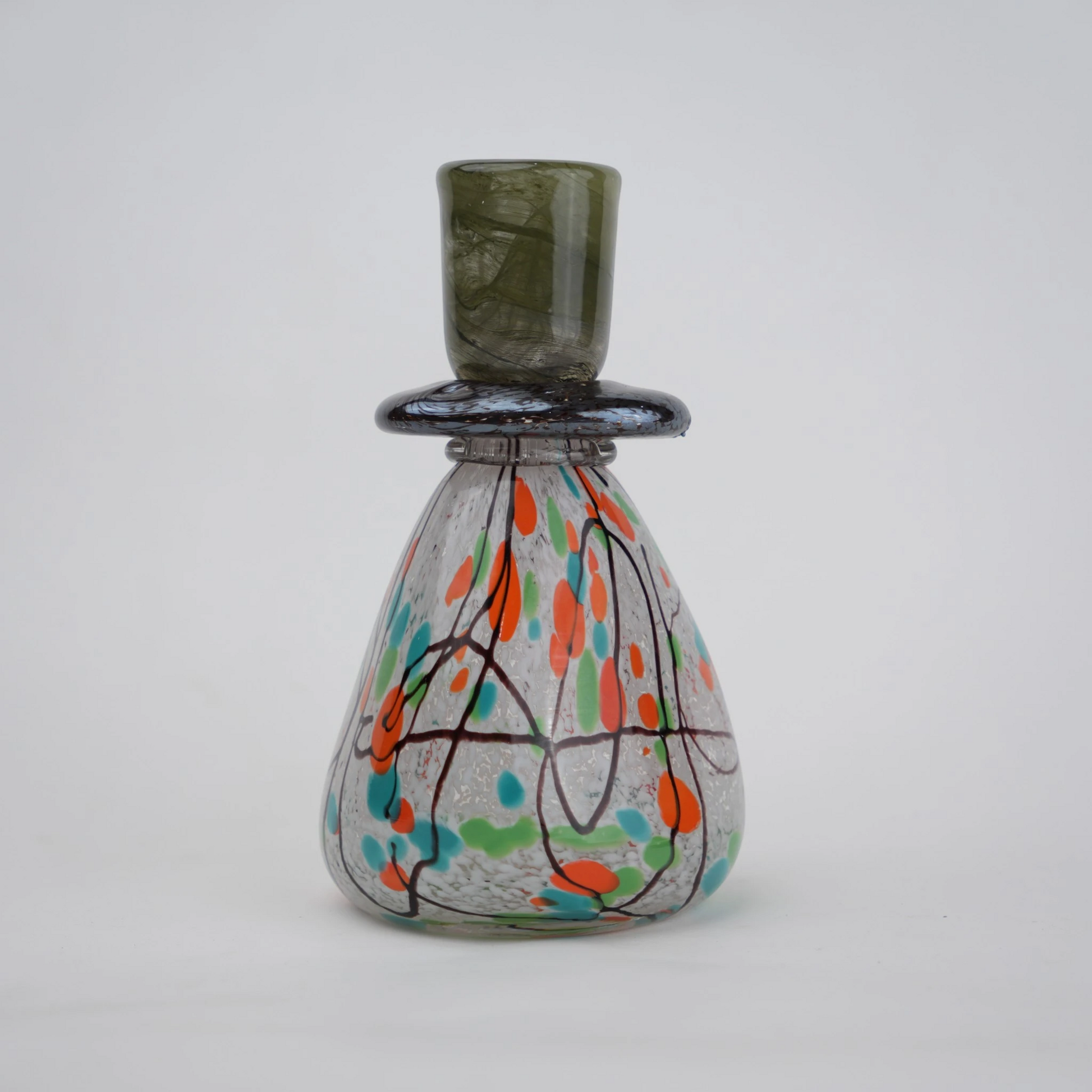 multicolor abstract glass candle holder with orange green accents and black drip design