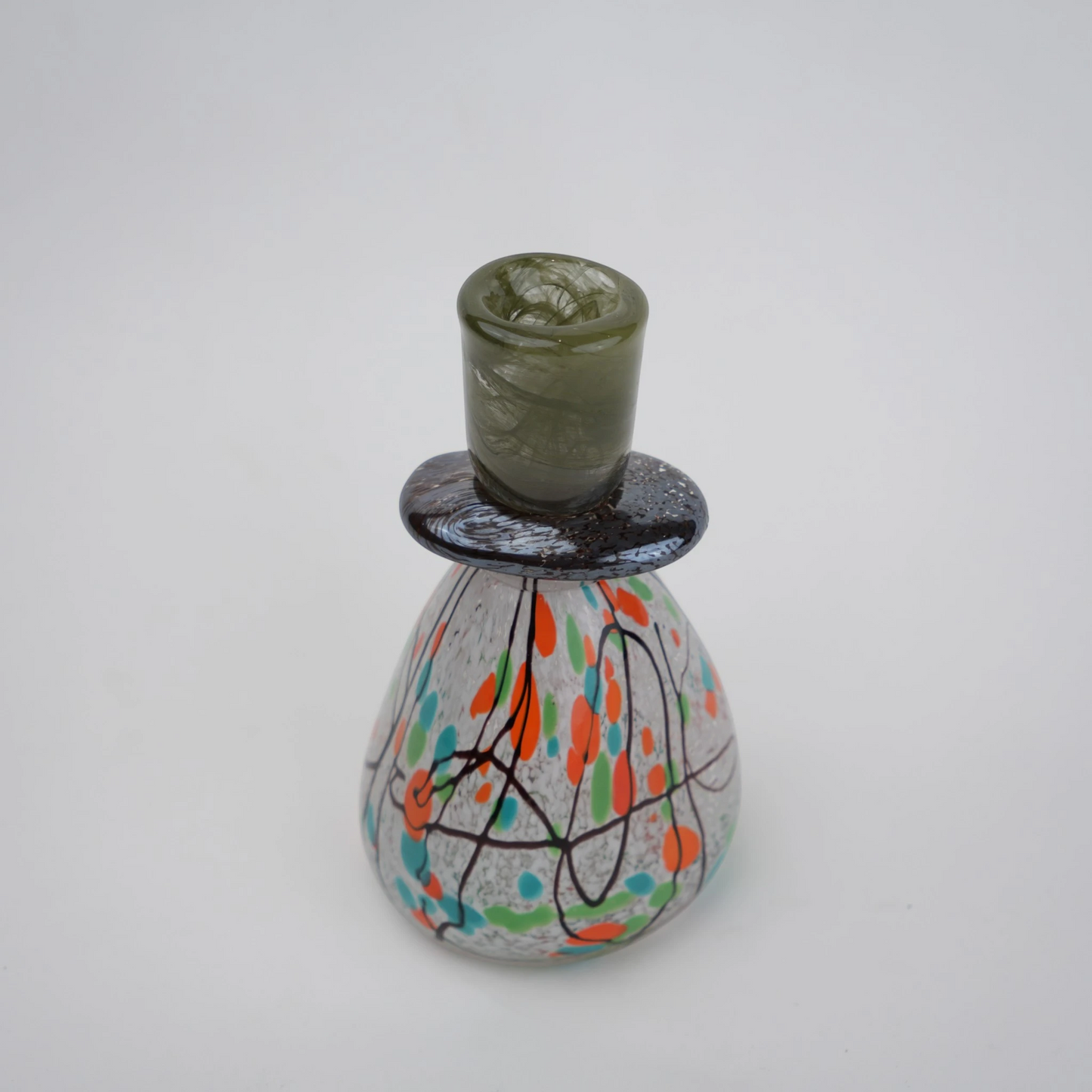 multicolor abstract glass candle holder with orange green accents and black drip design