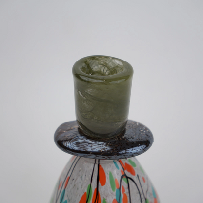 multicolor abstract glass candle holder with orange green accents and black drip design