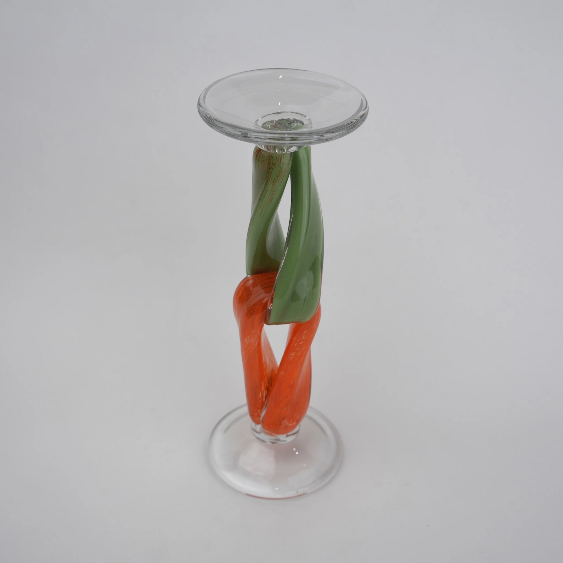Modern art glass candle holder with green body and orange accent frame