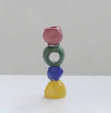 Colorful totem glass candle holder with stacked geometric design and circular ring center