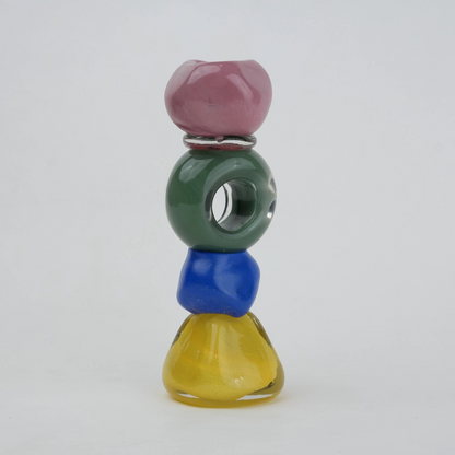 Colorful totem glass candle holder with stacked geometric design and circular ring center