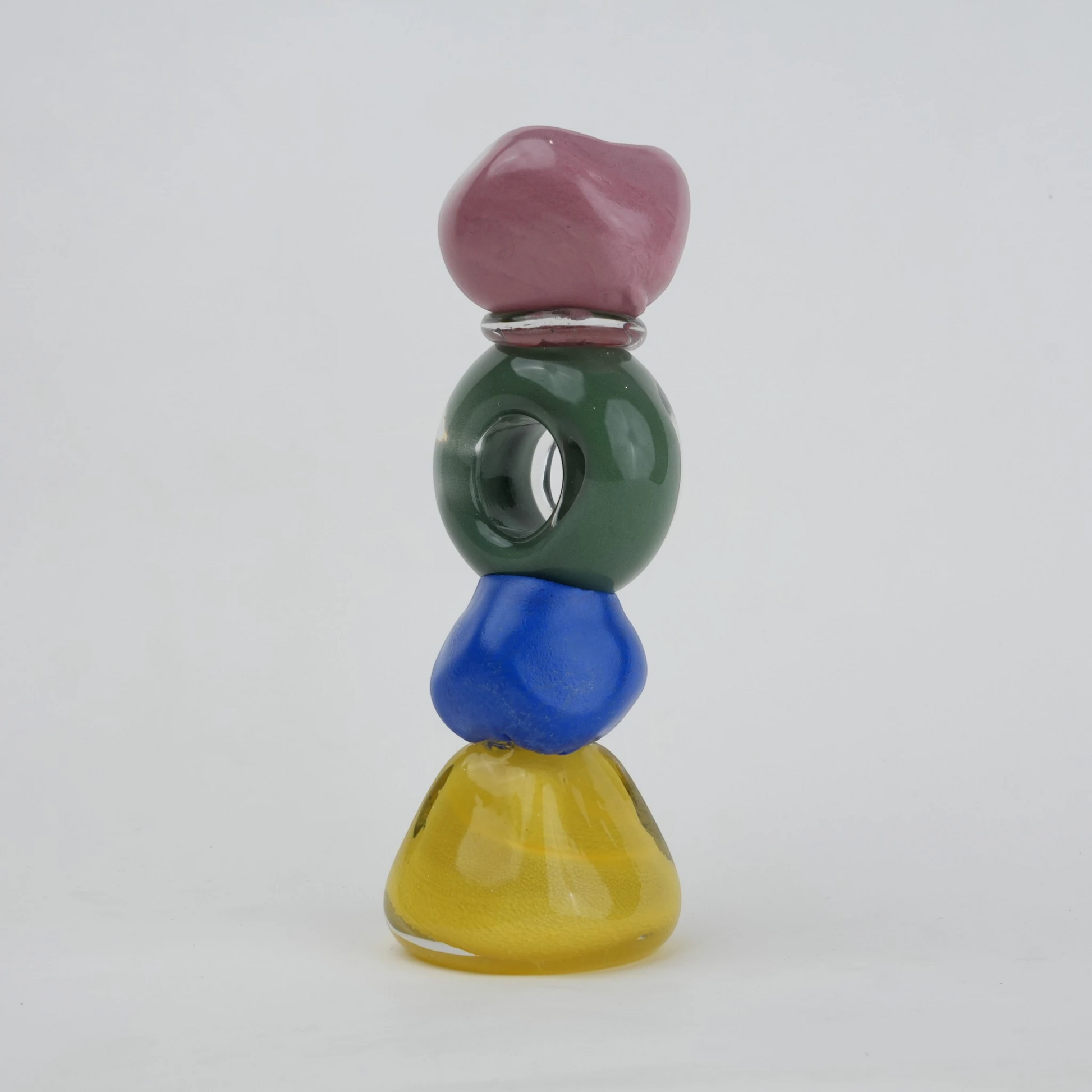 Colorful totem glass candle holder with stacked geometric design and circular ring center