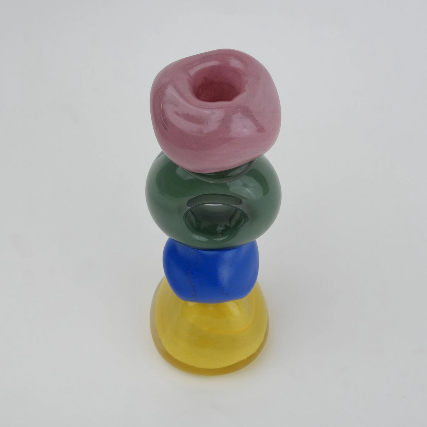 Colorful totem glass candle holder with stacked geometric design and circular ring center