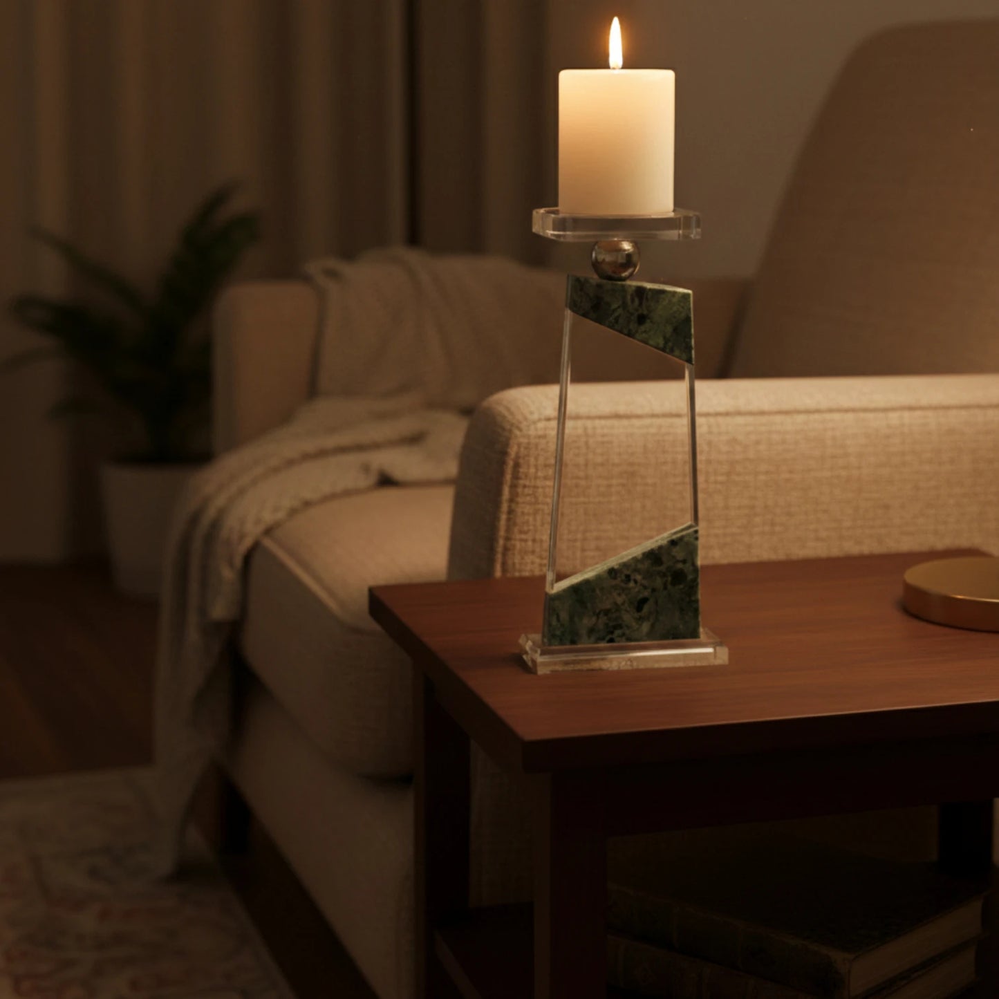 Clear geometric glass candle holder with aqua tinted base and circular design detail