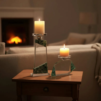 Clear geometric glass candle holder with aqua tinted base and circular design detail
