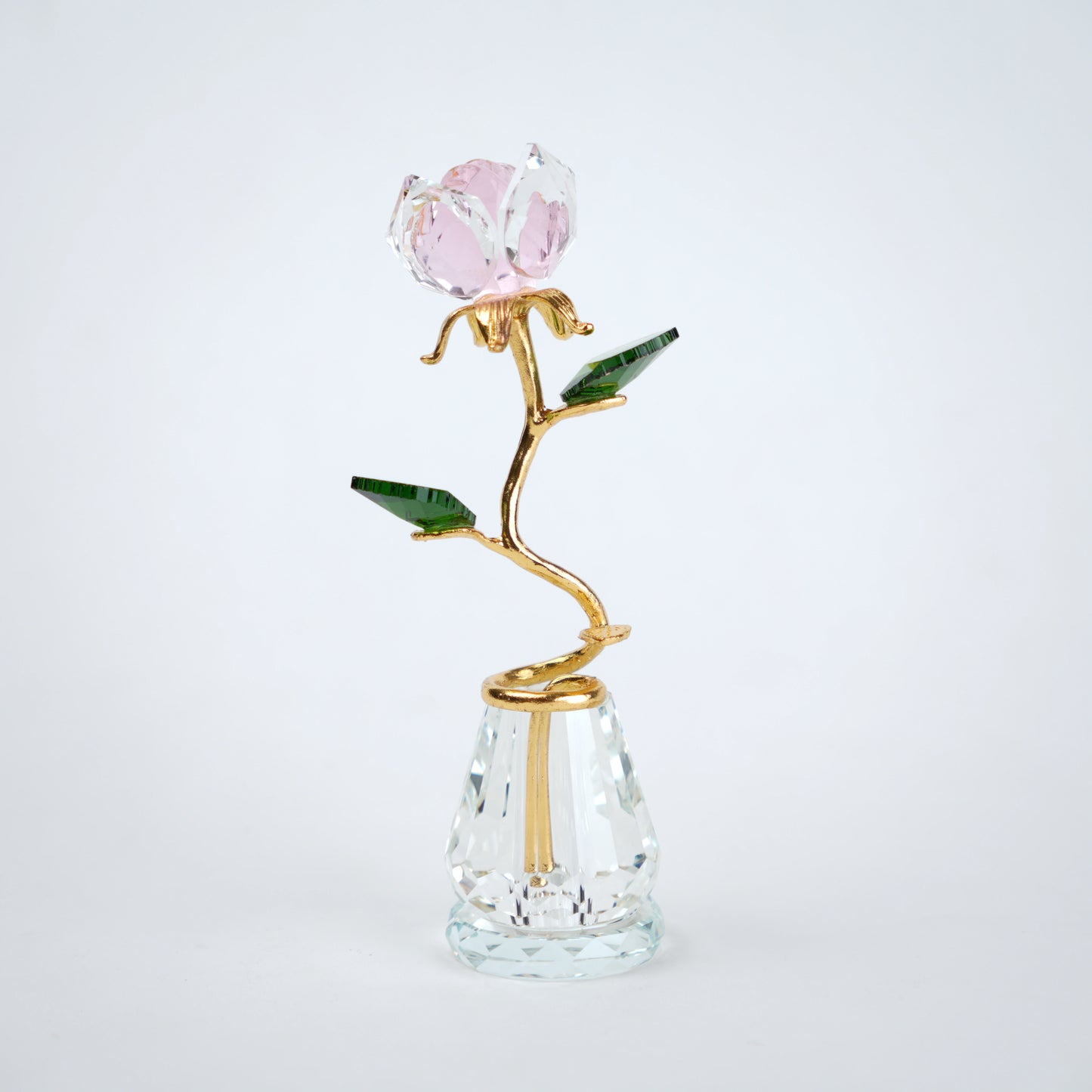 Decorative glass vase with a rose design on a white background