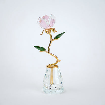 Decorative glass vase with a rose design on a white background
