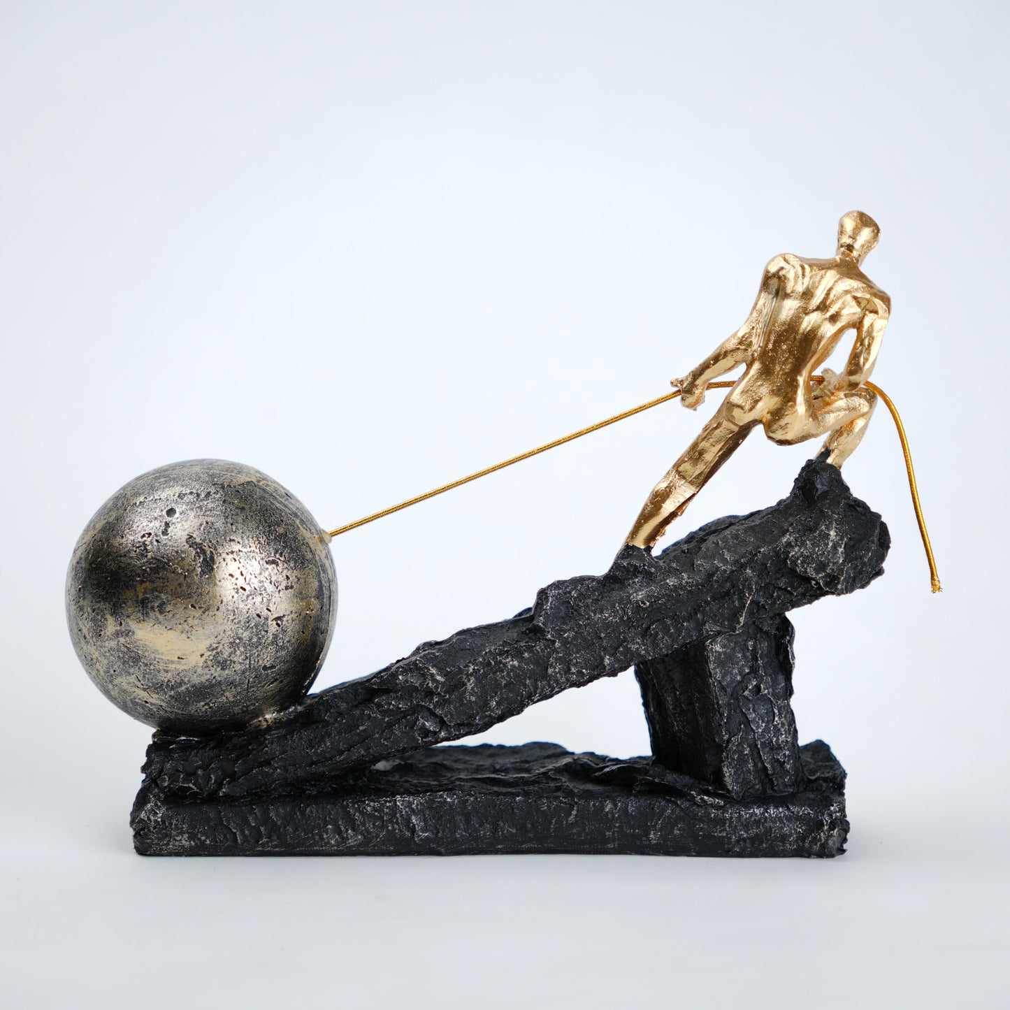Abstract resin figurine of man pulling ball artistic tabletop decor