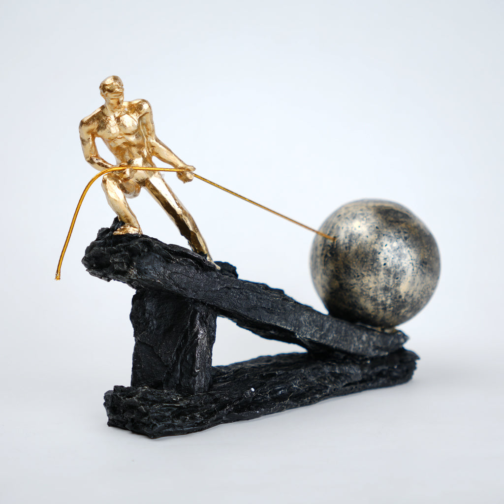 Abstract resin figurine of man pulling ball artistic tabletop decor