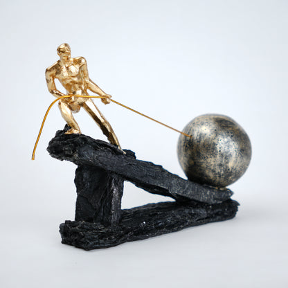 Abstract resin figurine of man pulling ball artistic tabletop decor