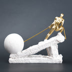 Abstract resin figurine of man pulling ball artistic tabletop decor