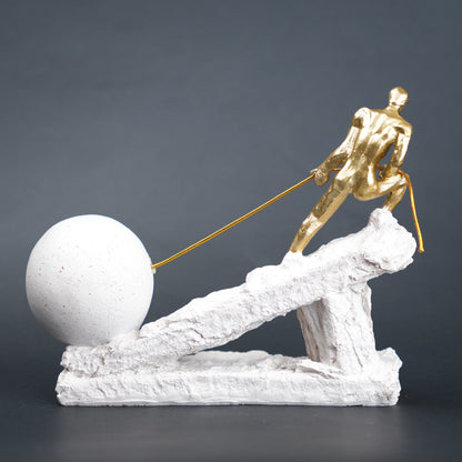 Abstract resin figurine of man pulling ball artistic tabletop decor