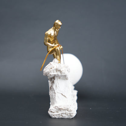 Abstract resin figurine of man pulling ball artistic tabletop decor