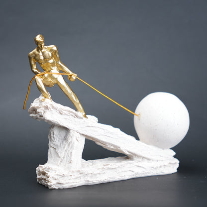 Abstract resin figurine of man pulling ball artistic tabletop decor