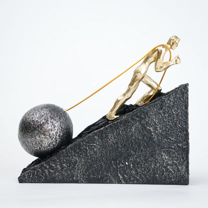 Gold climber figurine planting flag on textured stone incline base in black and white variants