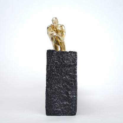 Gold climber figurine planting flag on textured stone incline base in black and white variants