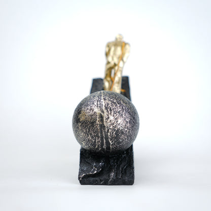 Gold climber figurine planting flag on textured stone incline base in black and white variants