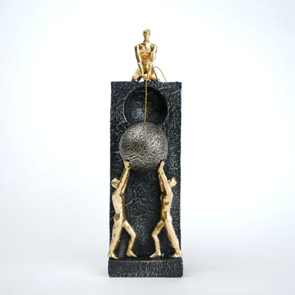 Teamwork figurine sculpture lifting sphere on textured stone base in black and white variants