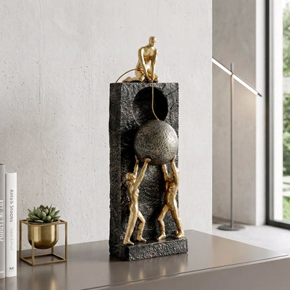 Teamwork figurine sculpture lifting sphere on textured stone base in black and white variants